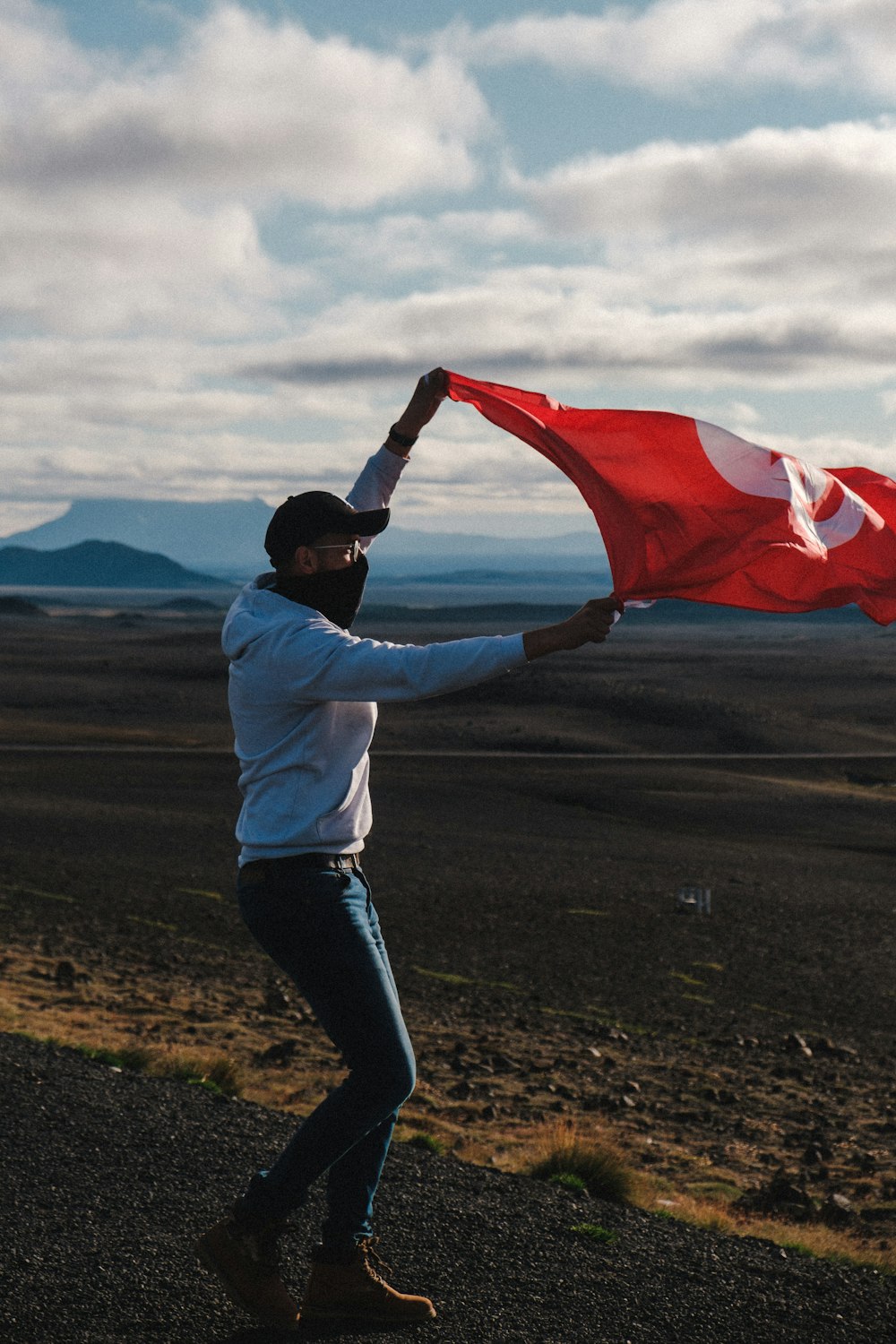 a person holding a red flag