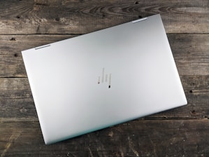 a white rectangular device on a wooden surface