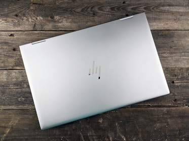 a white rectangular device on a wooden surface