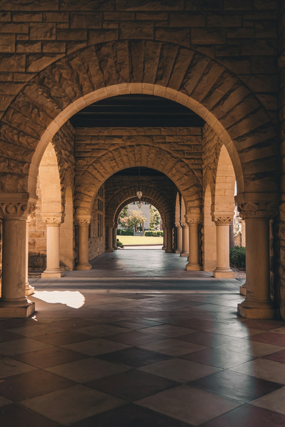 a stone walkway with pillars