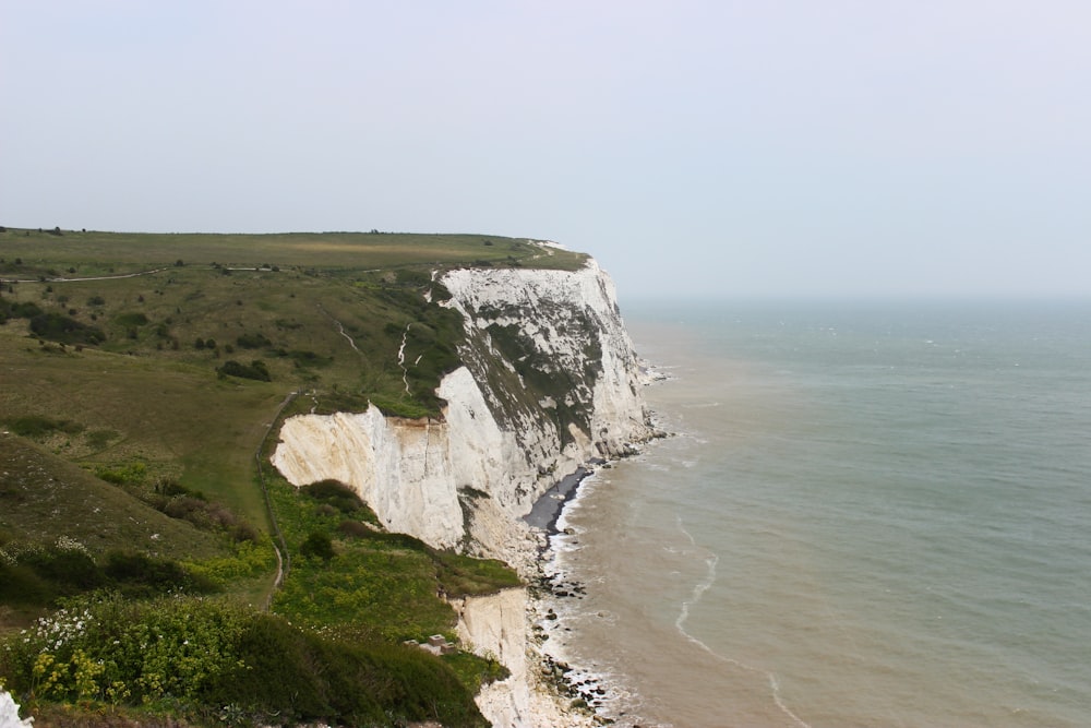 a cliff next to the ocean