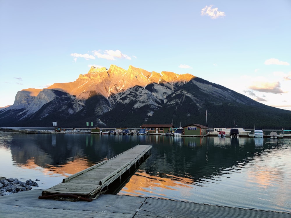 a dock leading to a mountain