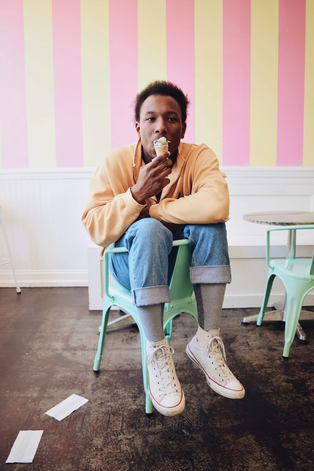 a person sitting in a chair eating