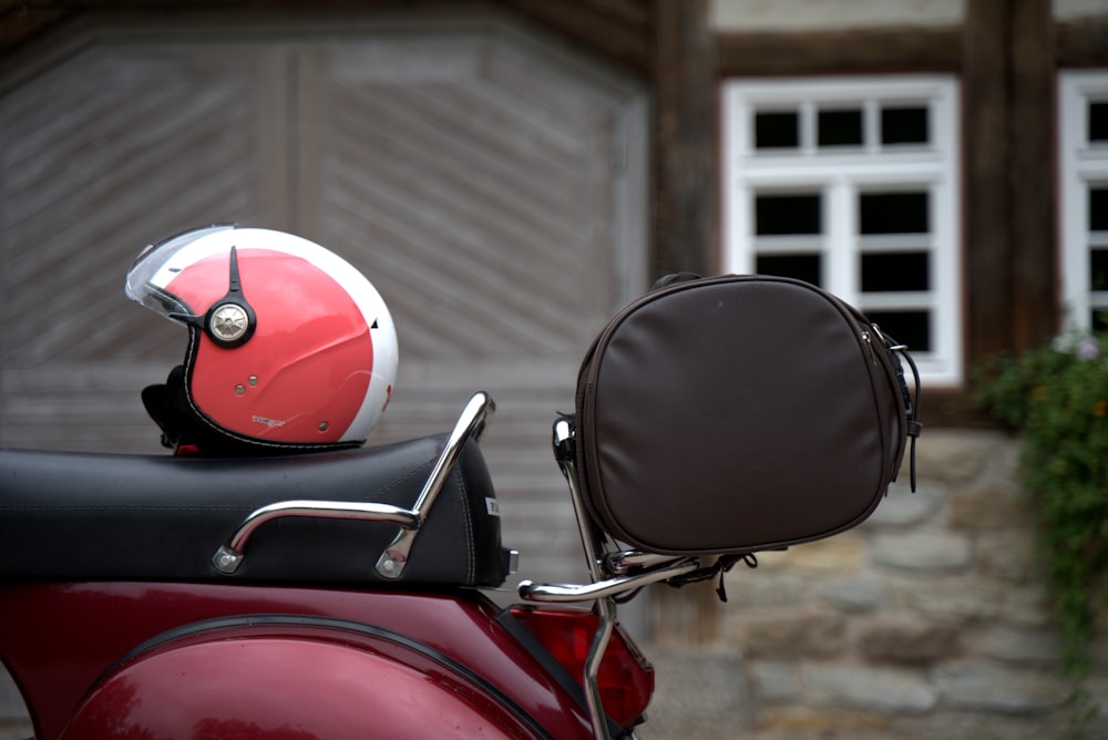 a red motorcycle with a helmet on it