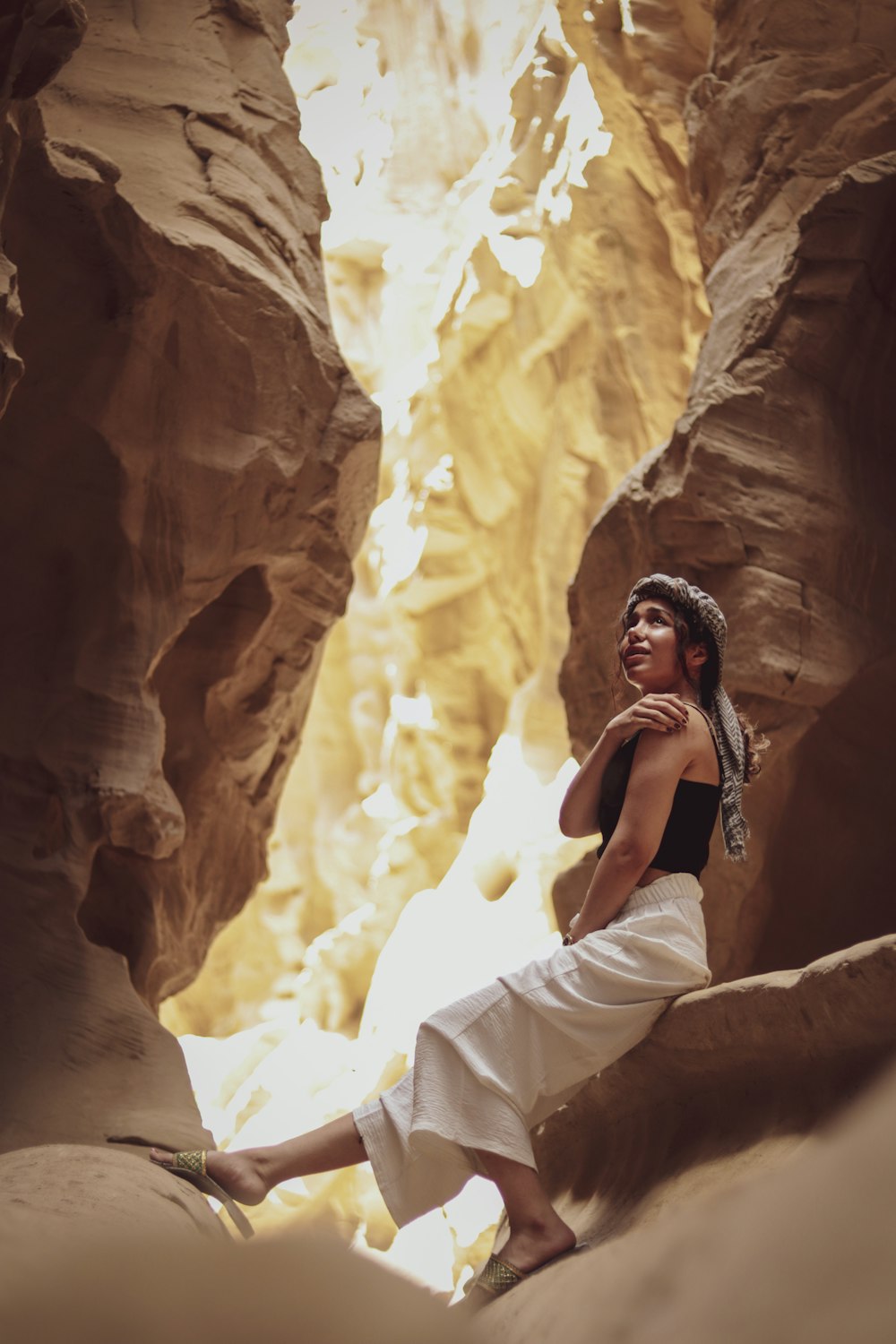 a person sitting in a cave