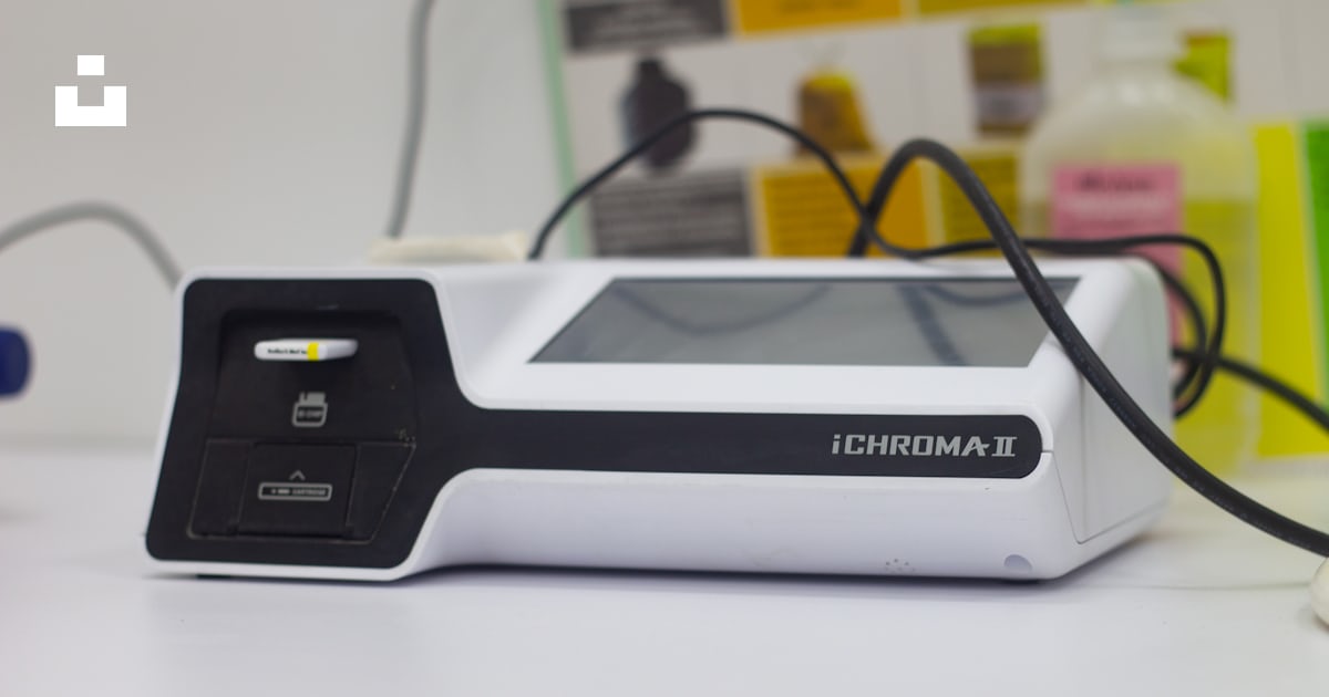 A black rectangular device with a wire coming out of it photo – Free ...