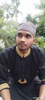 Model walking outdoors wearing a modern yet modest embroidered suit with soft gold highlights