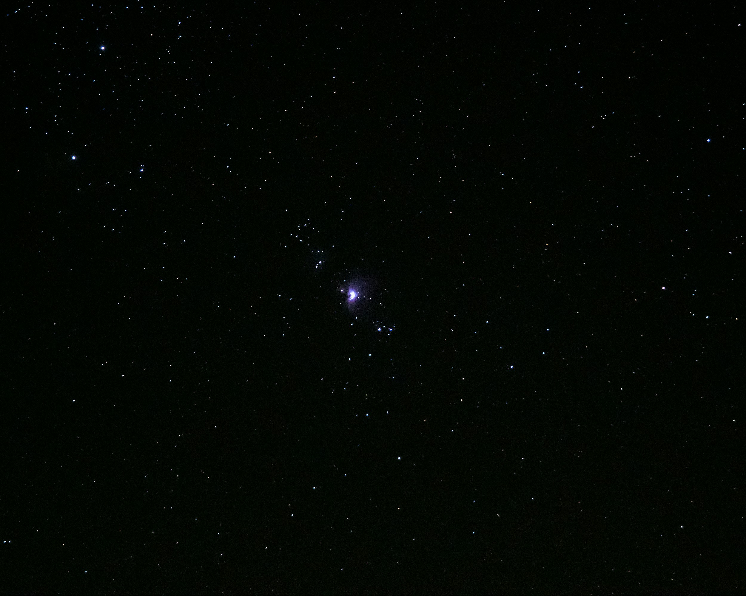 Foto Un cielo nocturno estrellado con una luz brillante en el medio con