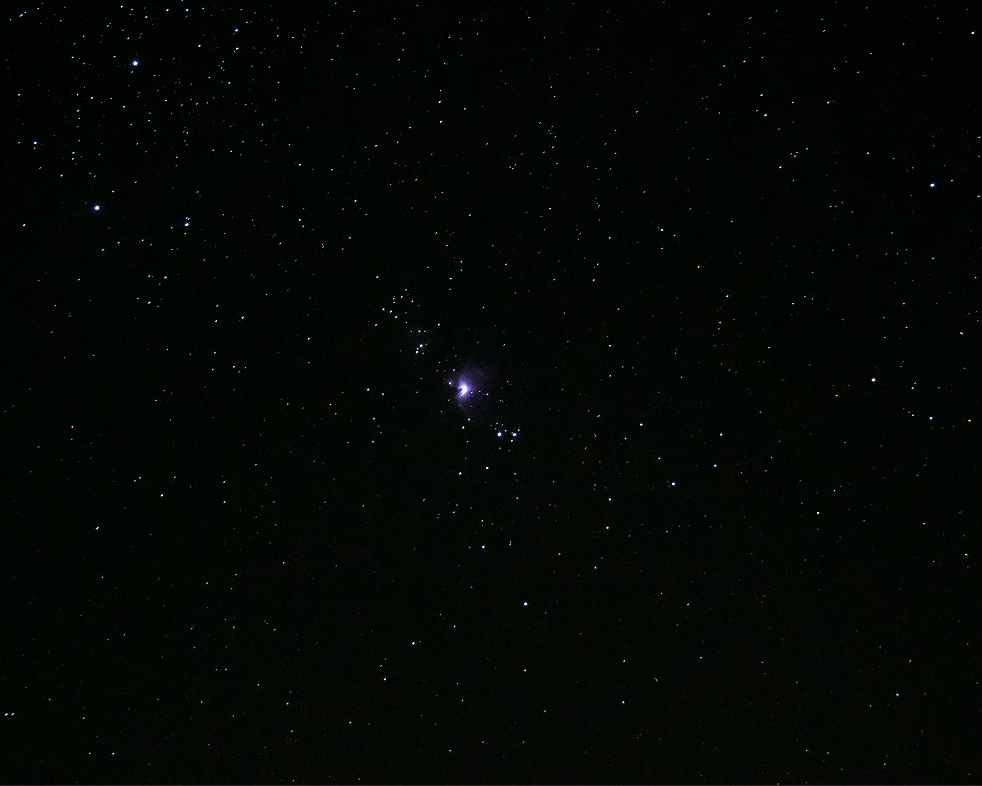 a starry night sky with a bright light in the middle with Gallery Arcturus in the background