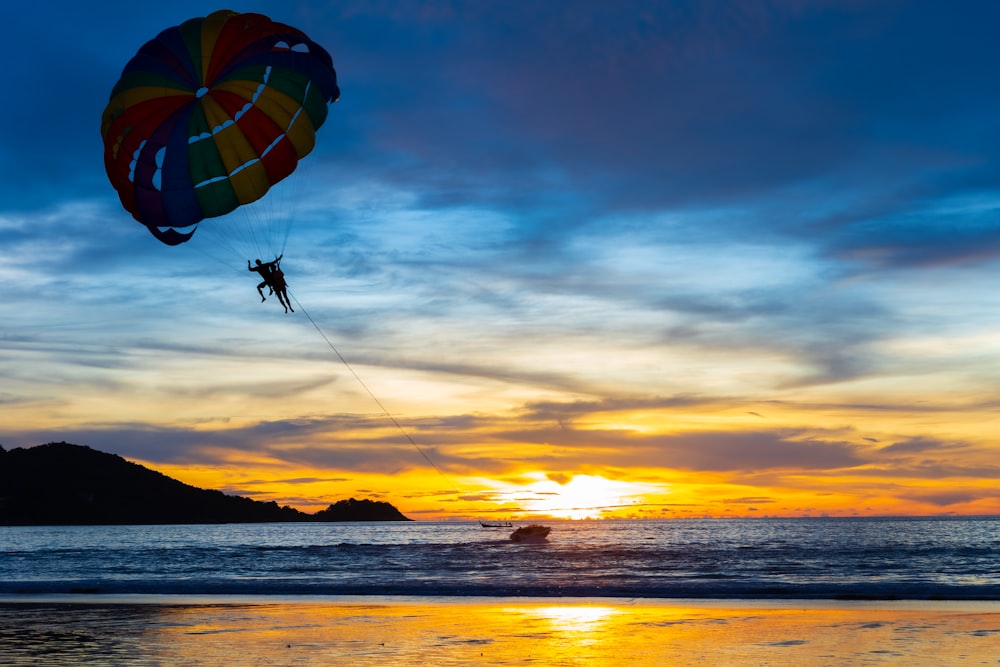 a person parasailing on a beach