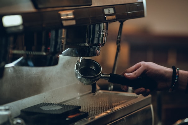 A professional coffee machine service technician at work.