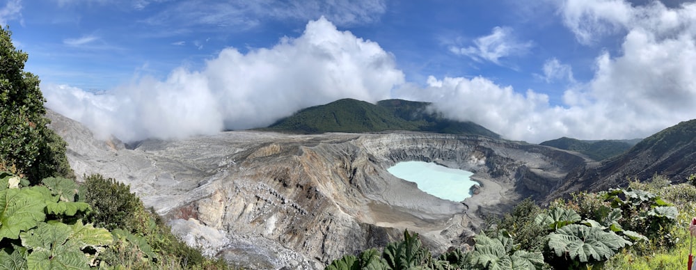 a large mountain with clouds