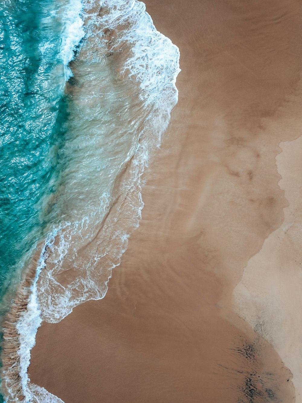 a wave crashing on a beach