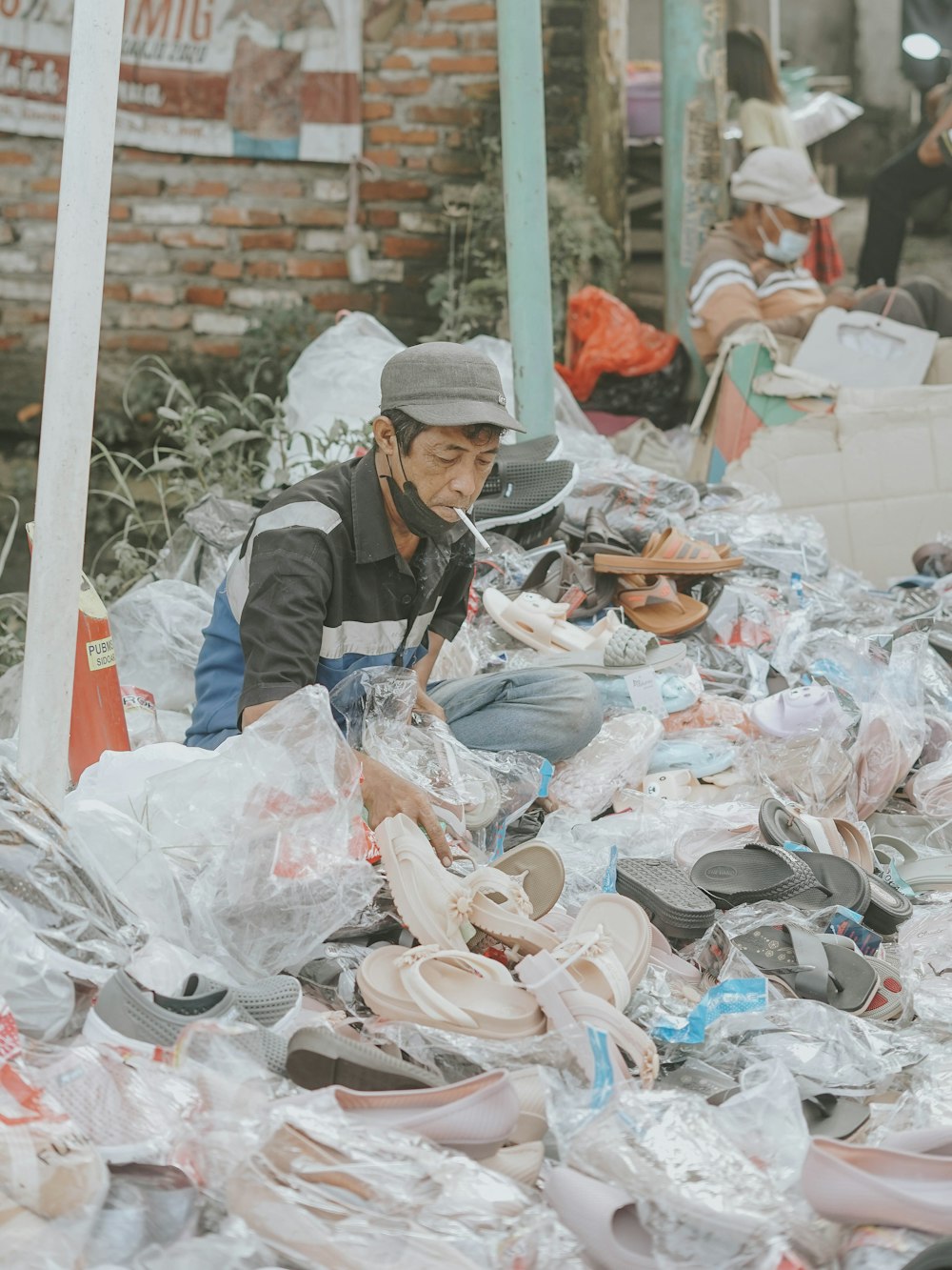 a person standing in a pile of garbage