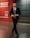 A confident man wearing a tailored suit in a city setting.