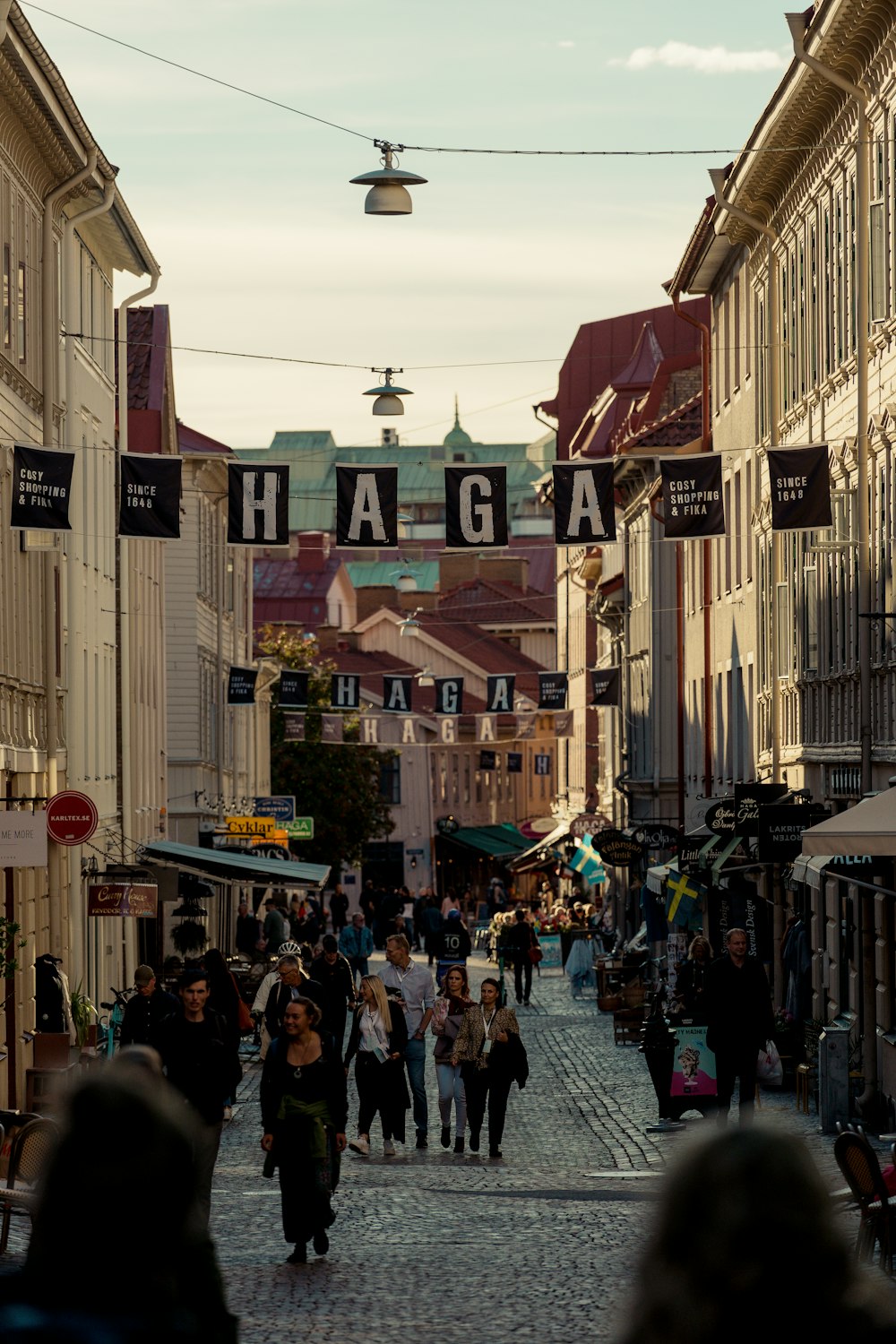 a group of people walking through a city