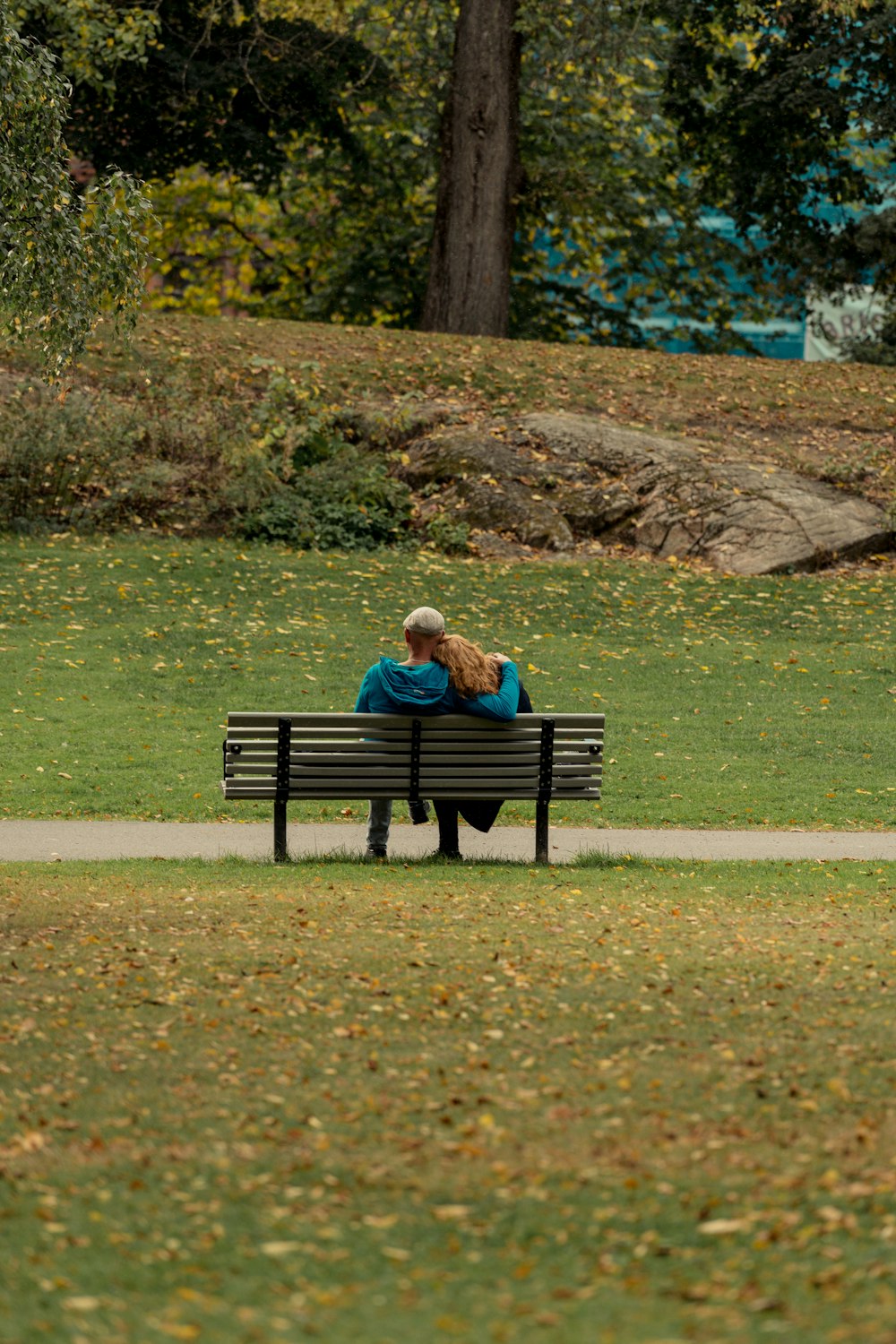 a couple sitting on a bench