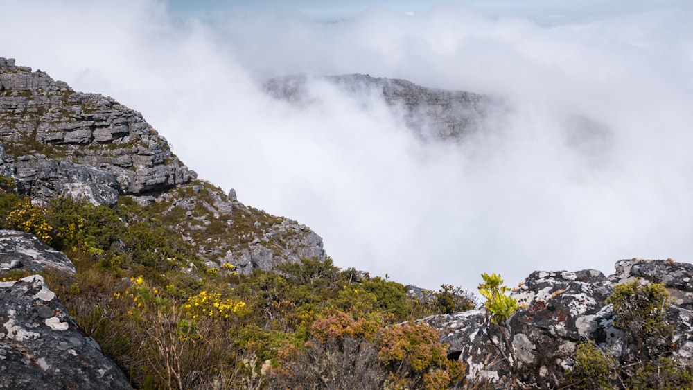 a rocky hillside with clouds