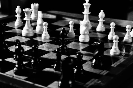 A chessboard with pieces in mid-game, symbolizing strategy.