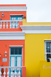 a yellow building with blue doors