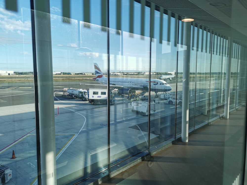a window with a view of an airplane and other planes