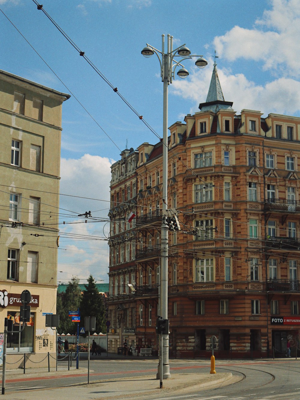 a street light in front of a large building