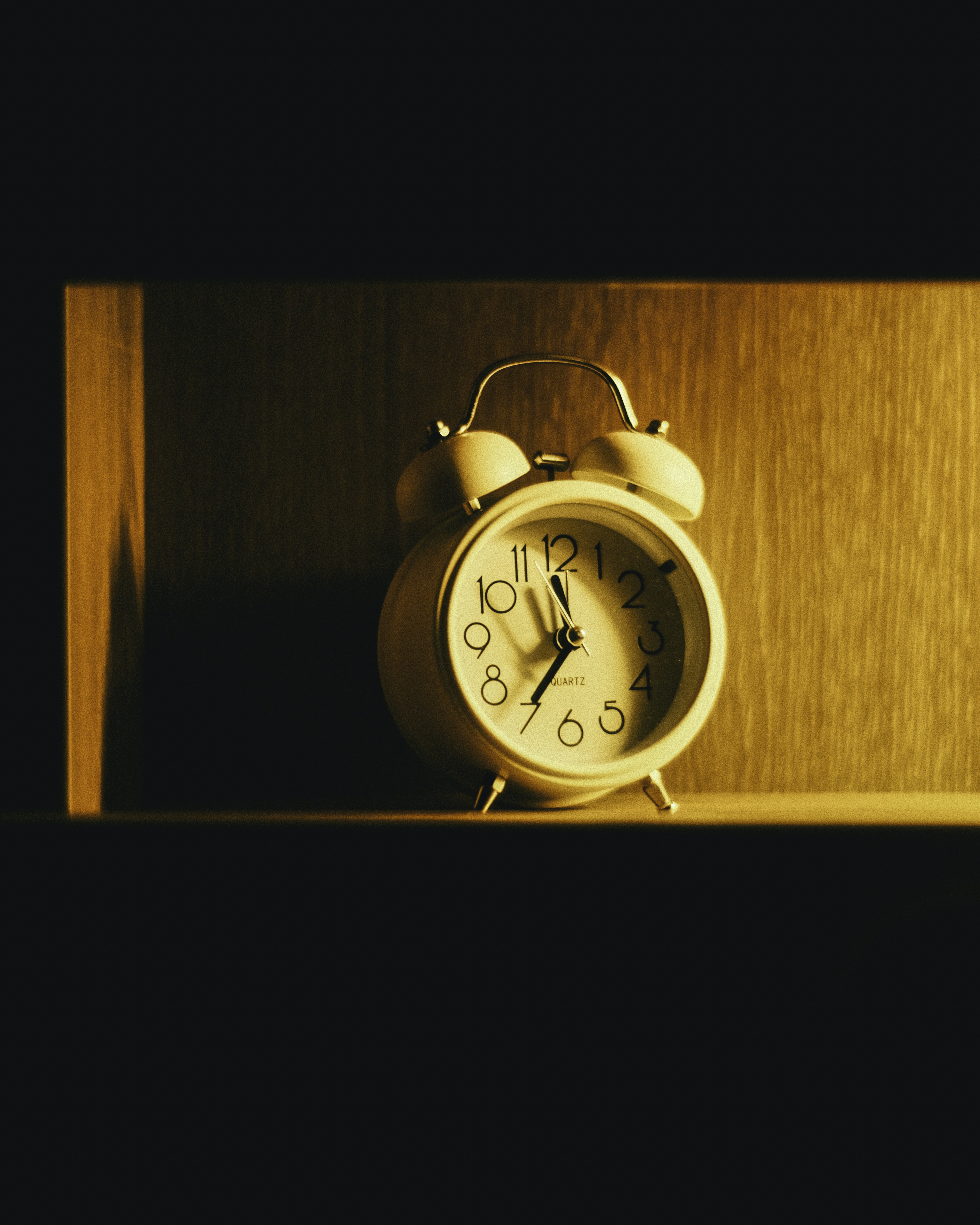 a clock on a shelf