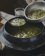 a bowl of soup with a spoon