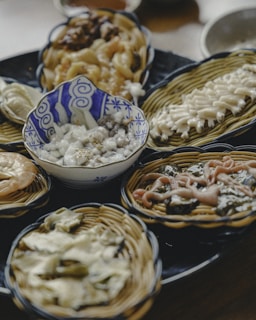 A colorful spread of traditional Ethiopian dishes on a woven basket.