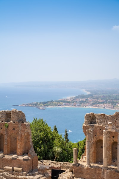 a view of a city and the ocean from a high building