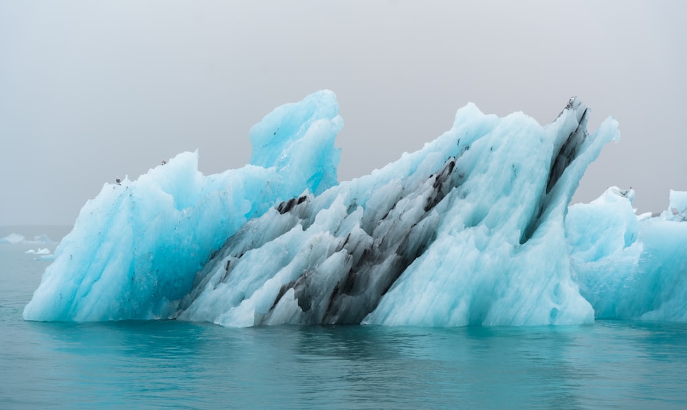 a group of icebergs in the water