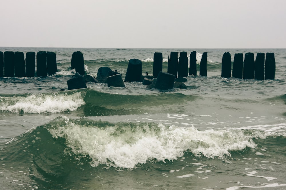 waves crashing against a rock wall