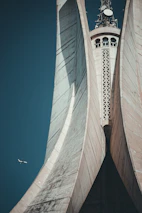 a large building towers over a city