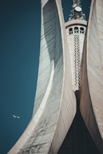 a large building towers over a city