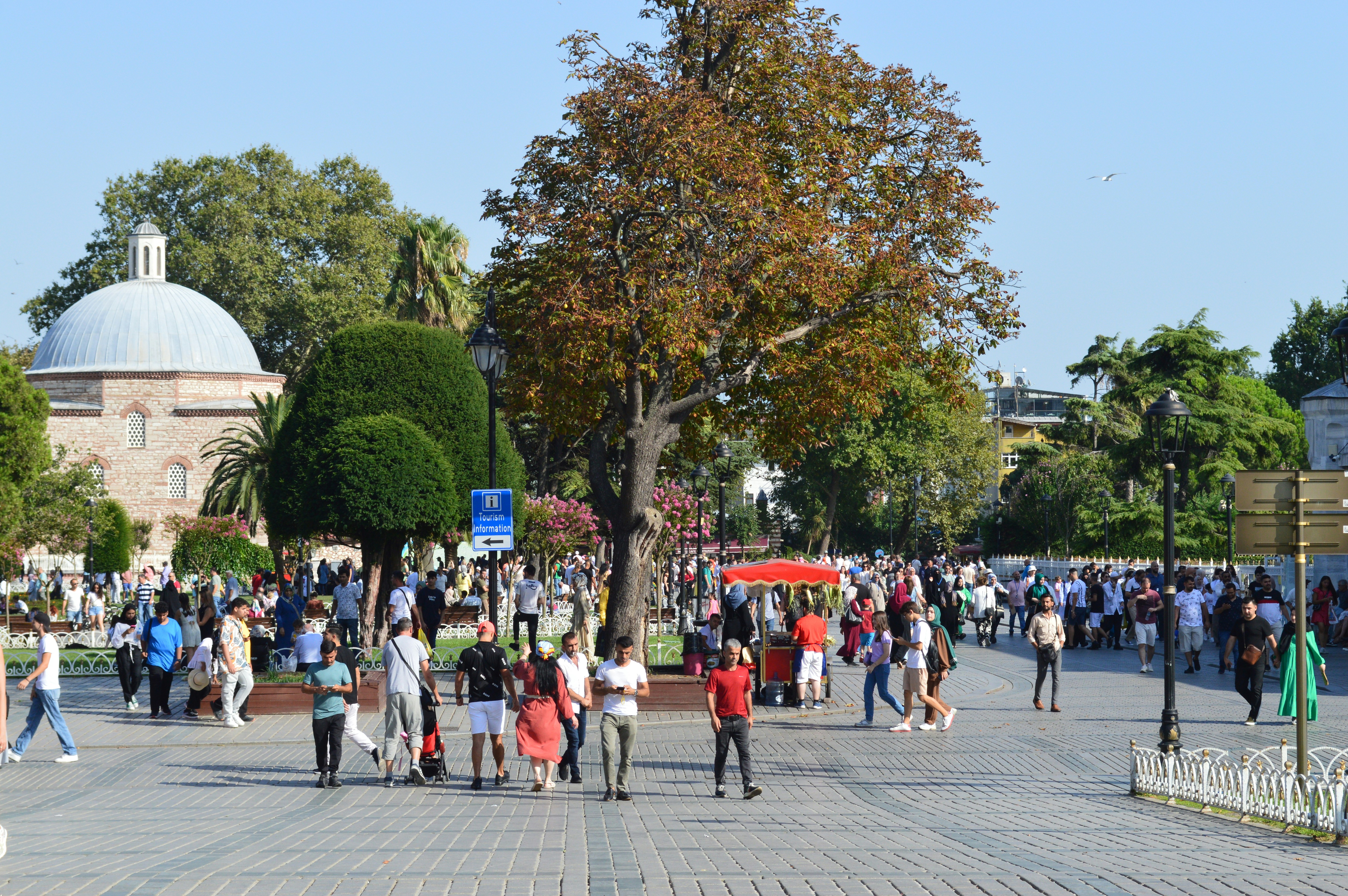 a group of people walking on a street