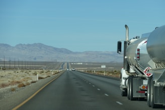 a semi truck driving down the highway