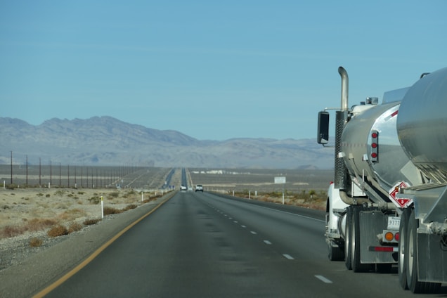 a semi truck driving down the highway