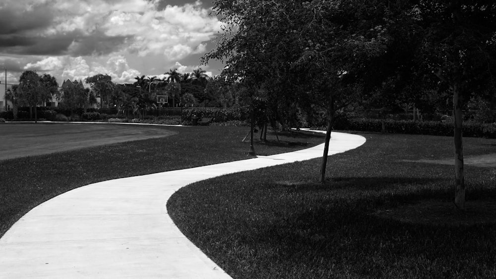 a sidewalk and trees