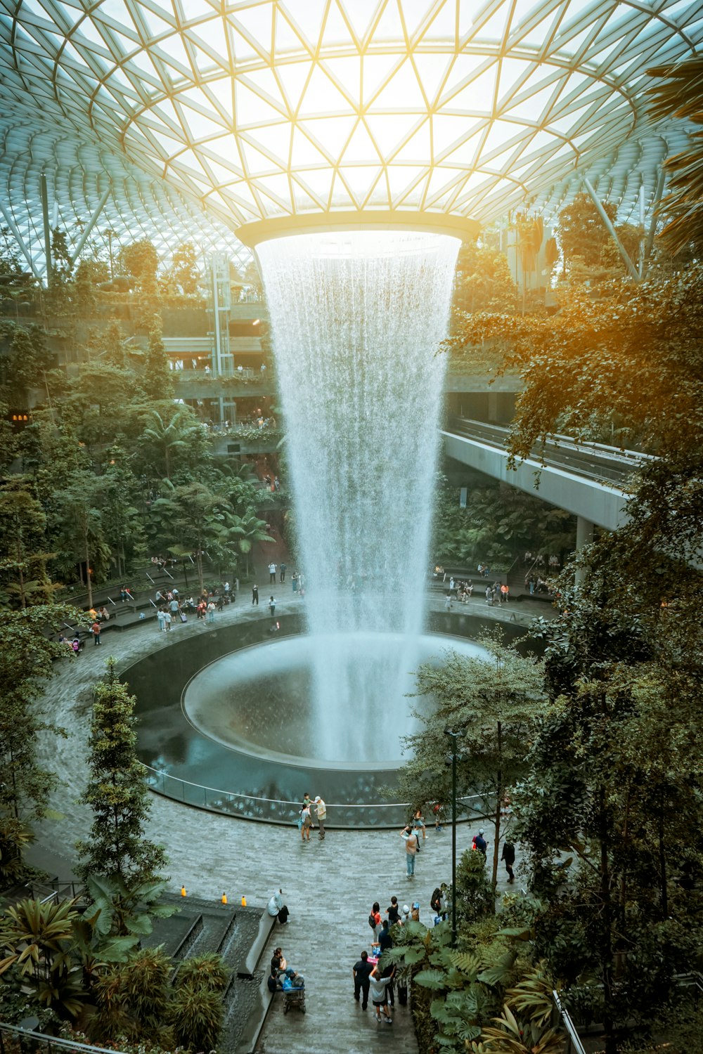 a large fountain with people around it