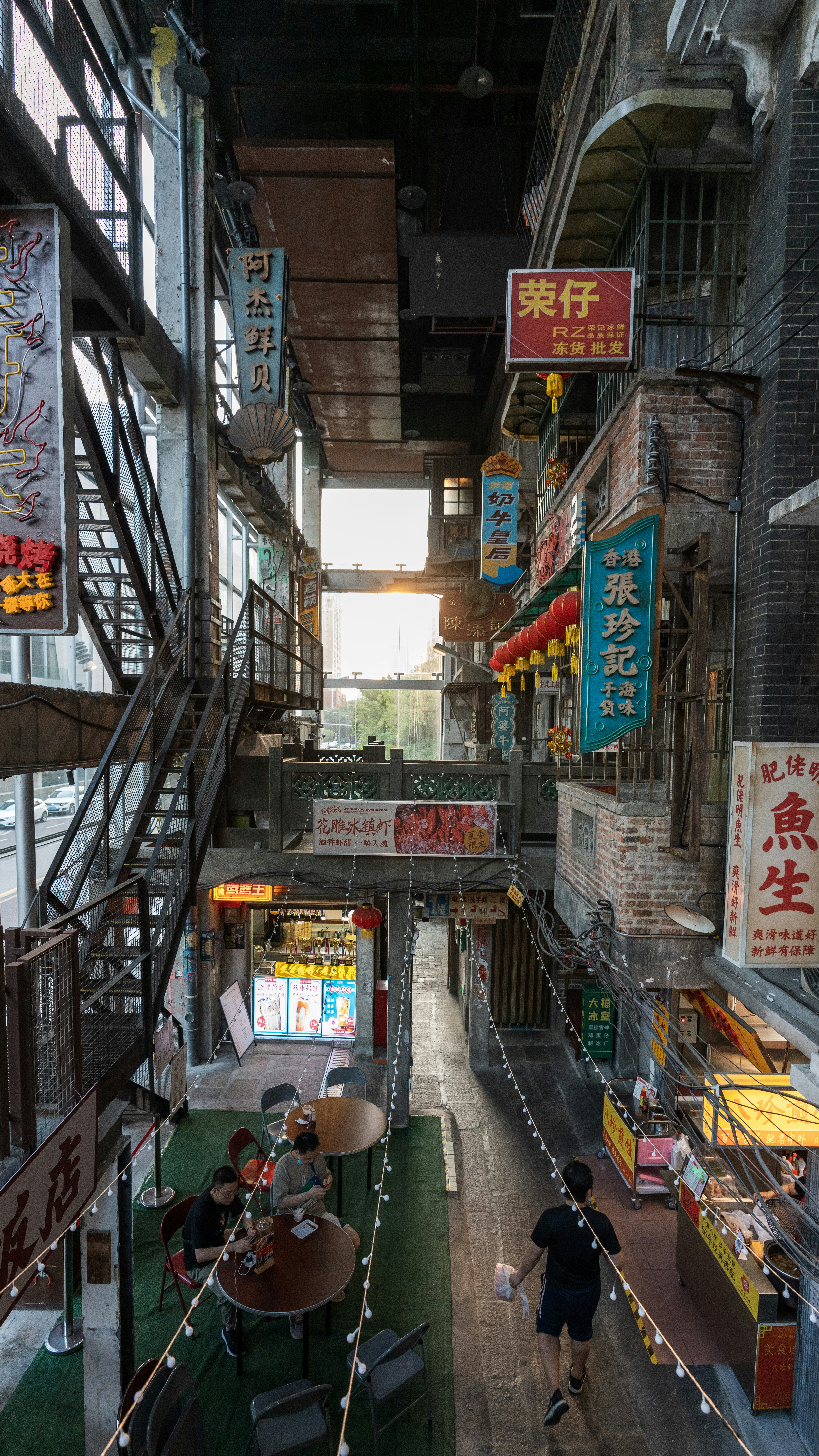 a street with many shops and people