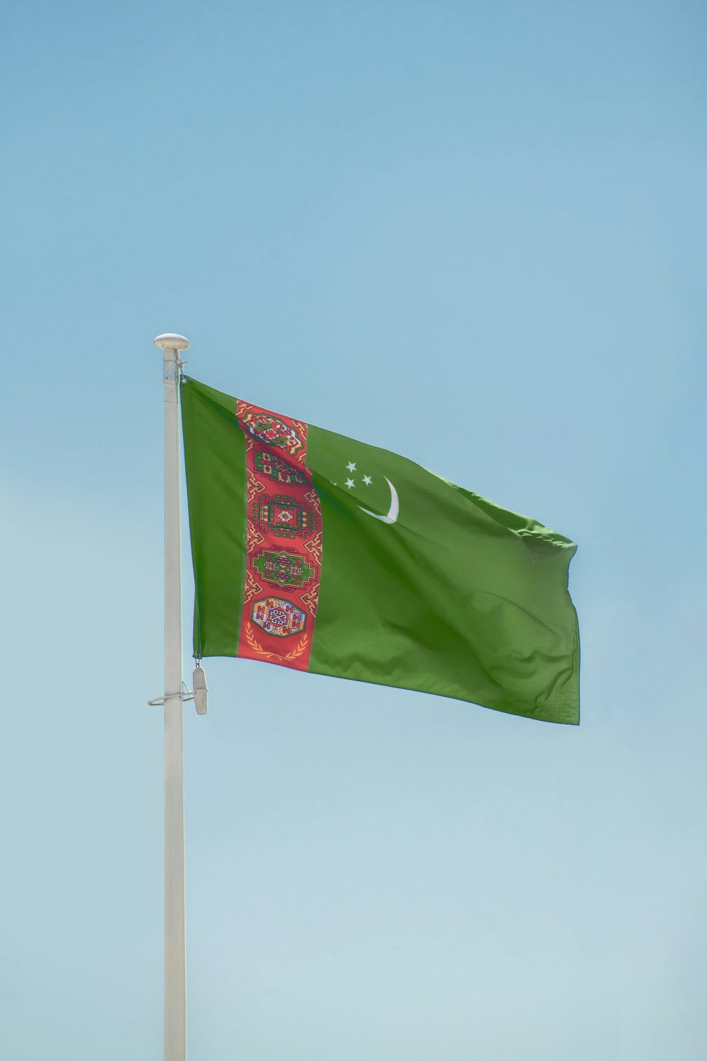 a green flag on a pole