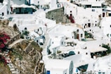 Traditional whitewashed houses with bougainvillea flowers in a Lefkada village