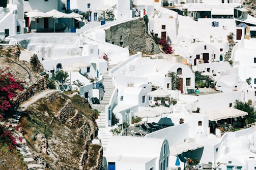 Traditional whitewashed houses with bougainvillea flowers in a Lefkada village