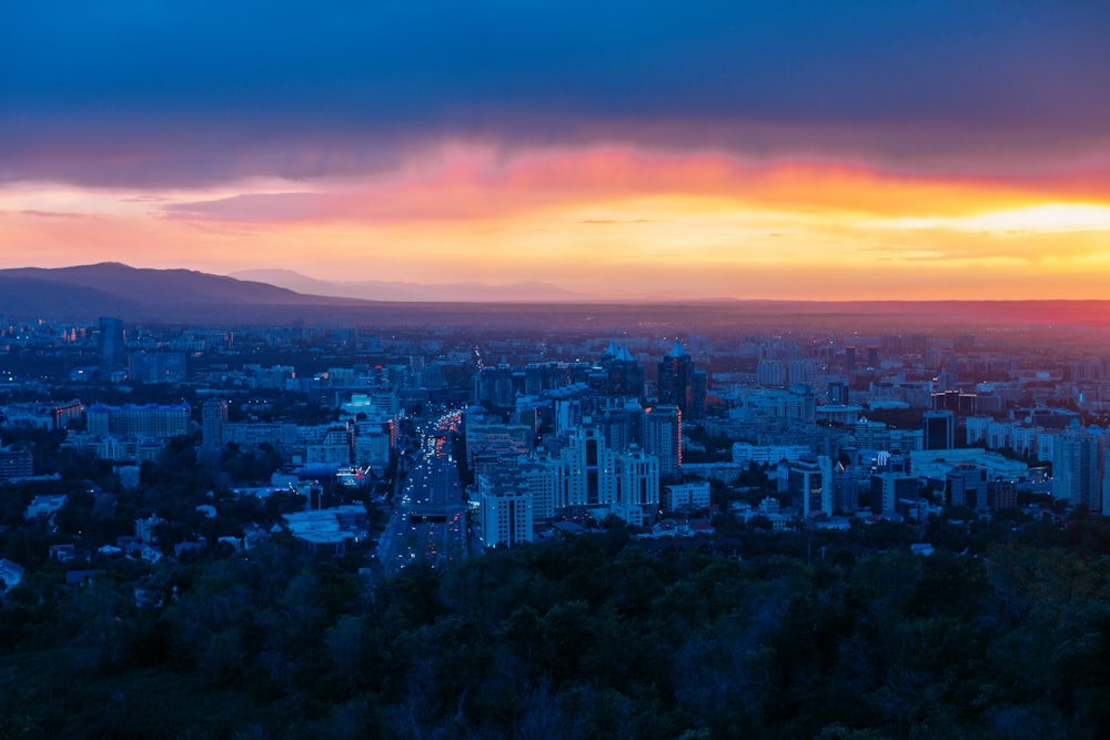 a city with a sunset in the background