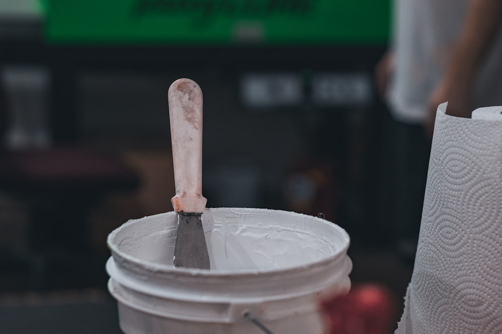 a wooden spoon in a cup