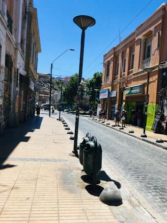 a street with a motorcycle parked on the side