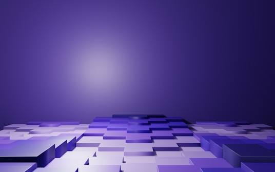 A series of interlocking, reflective 3D tiles arranged in a gradient pattern, extending towards a distant vanishing point set against a deep purple background. The tiles appear to have a glossy surface, with varying shades of purple and white, creating a sense of depth and dimension.