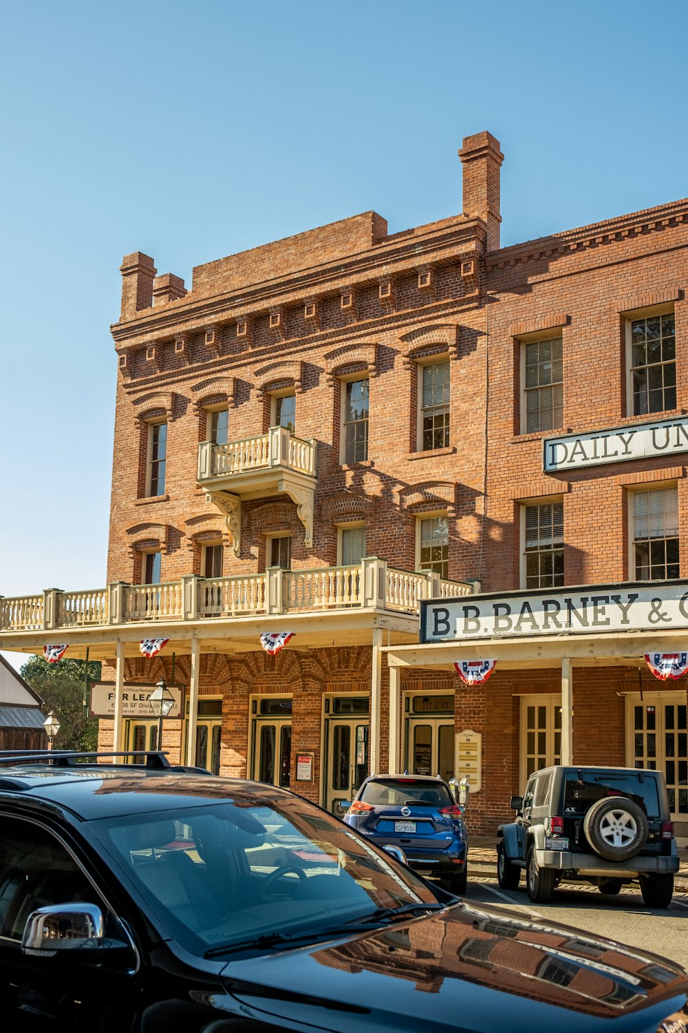 a building with cars parked in front