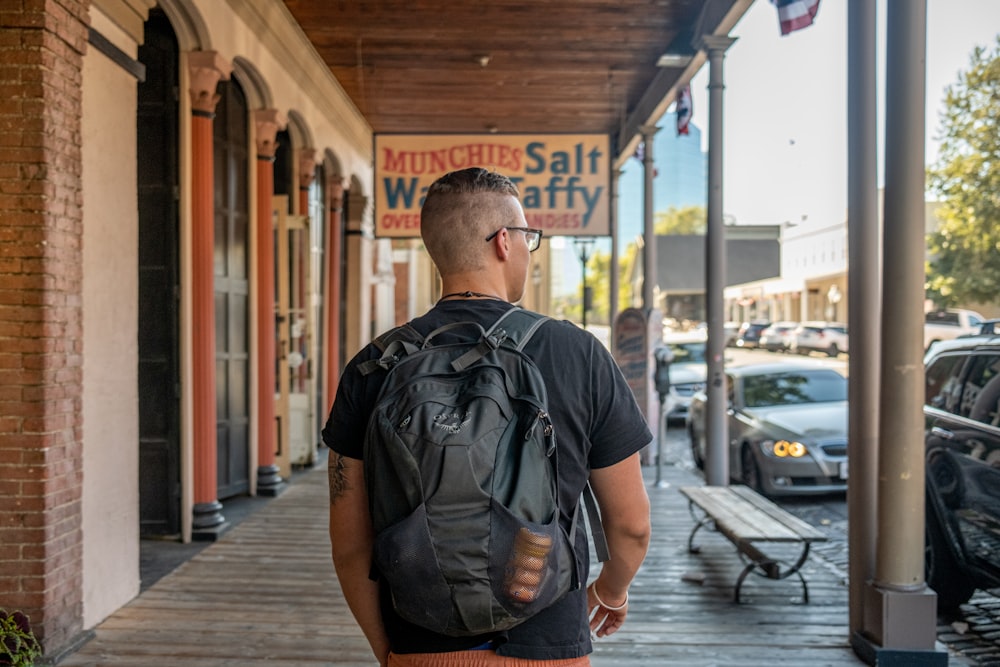 a man walking down a sidewalk