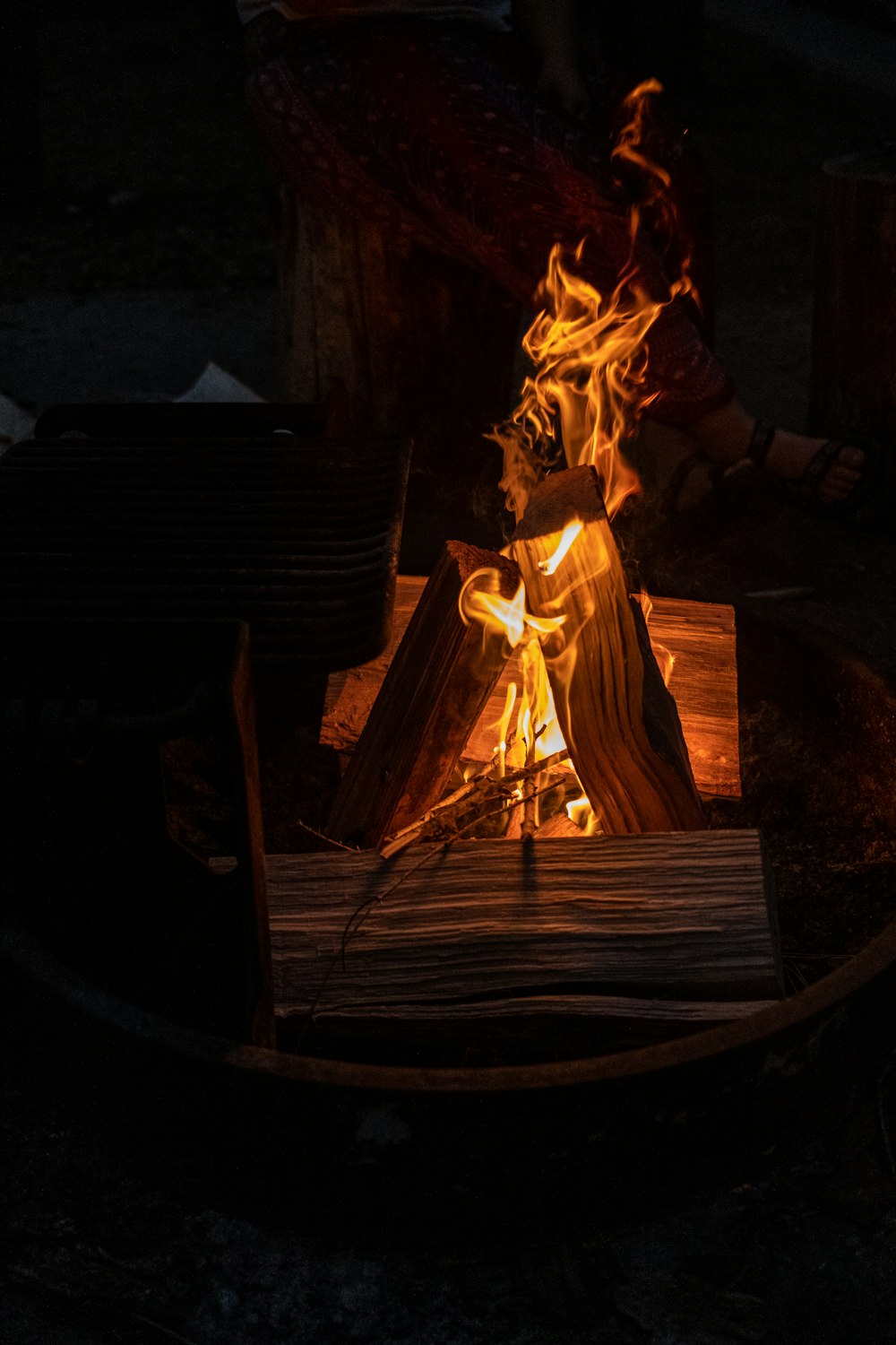 a fire pit with a wood burning pit